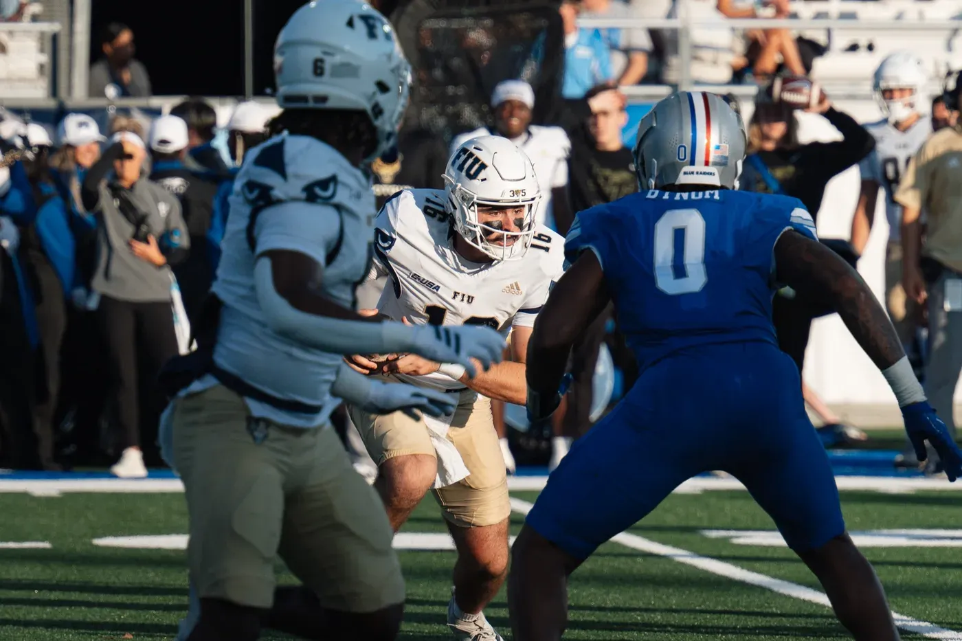 Athletes competing under stadium lights